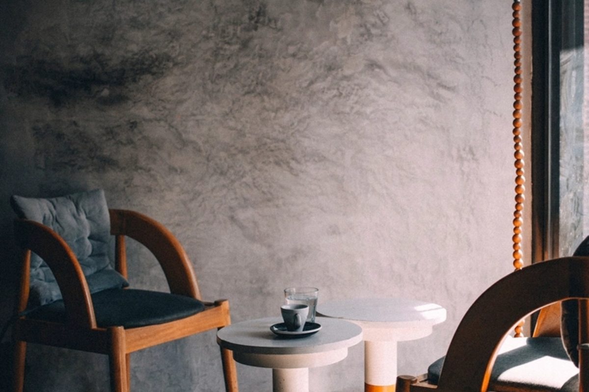 A tidy living area with armchairs and a coffee table