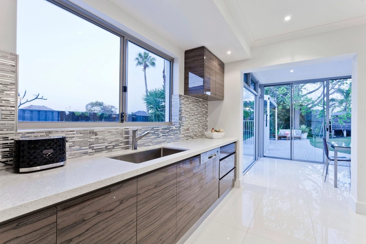A bright modern kitchen with a clean benchtop